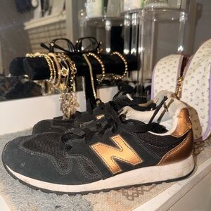 New Balance Black with Metallic Bronze Accent Sneakers